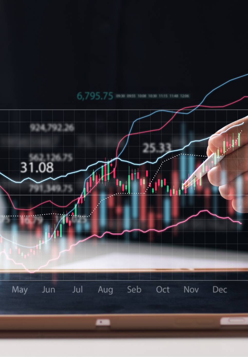 Image of computer monitors in an office displaying various data.