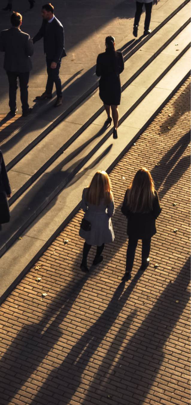 Aerial view of people walking on the pavement.