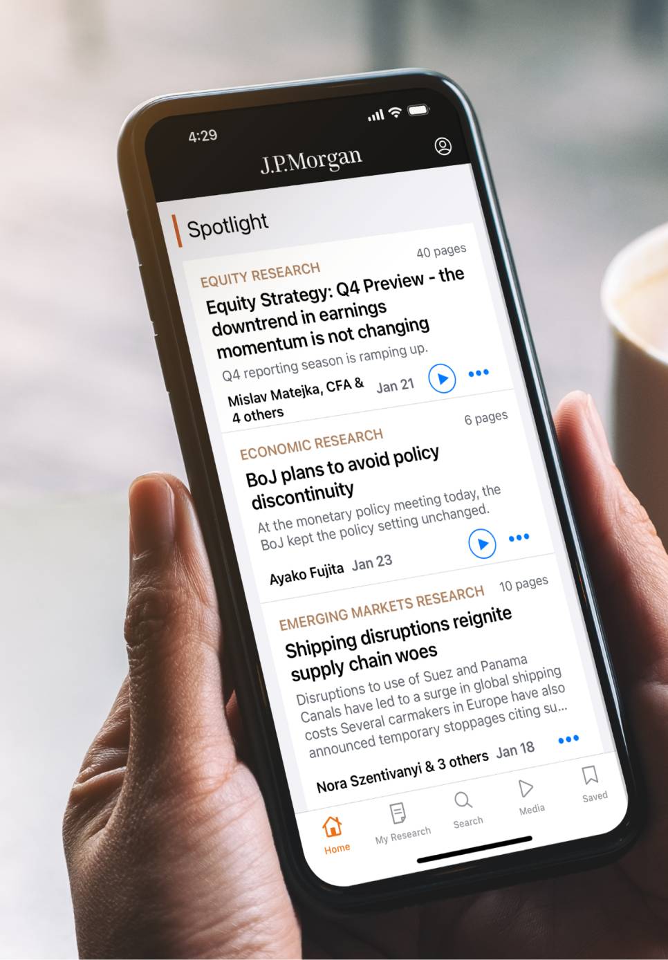 Mobile screen displaying spotlight articles on Research page.